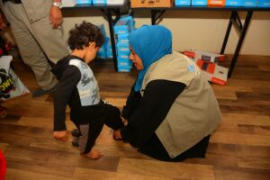 1045 orphaned children starts receiving Eid al-Firt clothing from Mona Relief